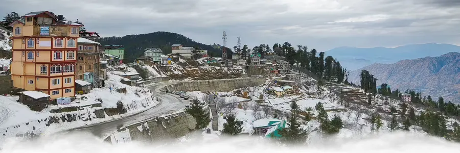 Dalhousie in Himachal Pradesh with light snowfall, pine forests, and colonial architecture